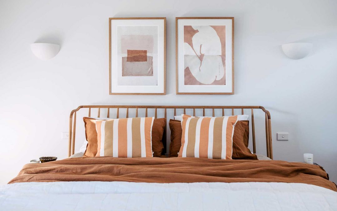 HOW TO HANG ARTWORK ABOVE A BED